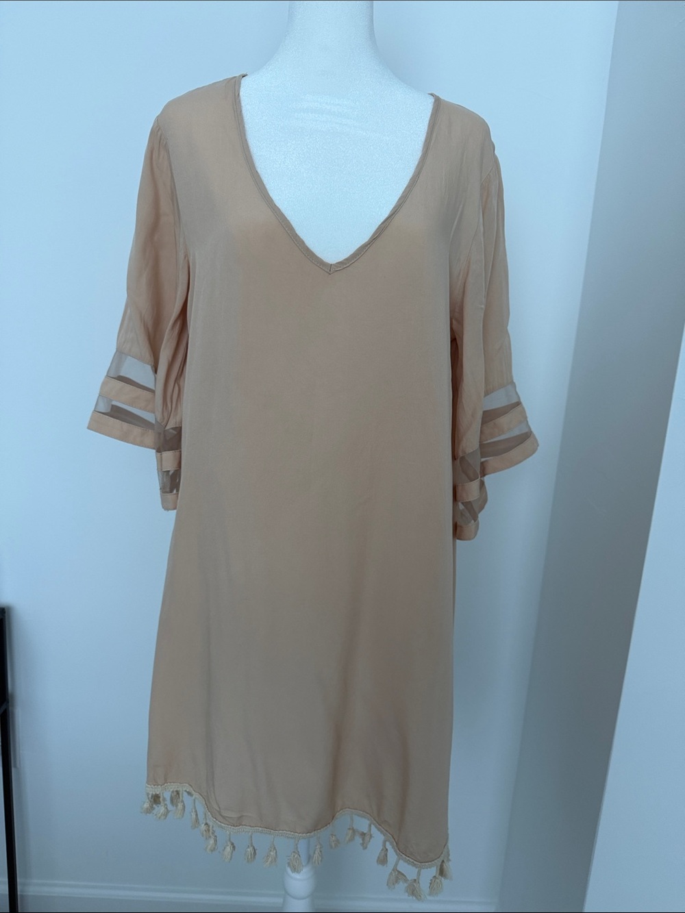 Beige swim suit coverup with tassel detail